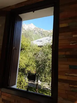 a window with a view of a mountain at Appartement Cham-Vue in Chamonix-Mont-Blanc