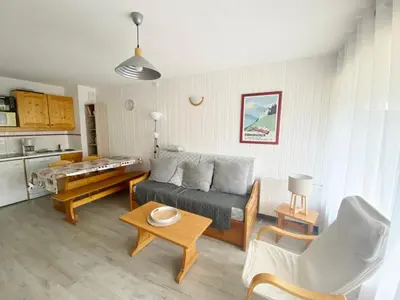 a living room with a couch and a table at Agréable 2 Pièces au pied des pistes, WIFI, Animaux admis - FR-1-815-74 in Morillon