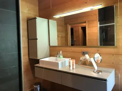 a bathroom with a sink and a mirror at Grand chalet Le Trappeur - Chamonix in Chamonix-Mont-Blanc