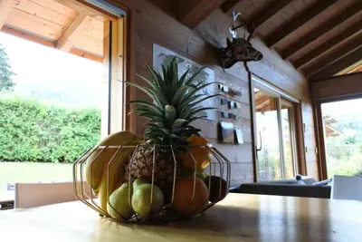 a pineapple in a basket on a table at Grand chalet Le Trappeur - Chamonix in Chamonix-Mont-Blanc