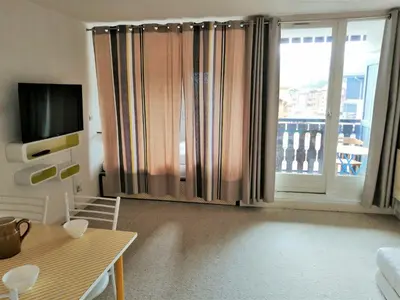 a living room with a white couch and a table at Grand studio avec coin montagne WiFi pour 4 pers. à Morillon 1100 - FR-1-815-75 in Morillon