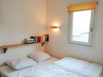 a dining room with a table and chairs and a tv at Grand studio avec coin montagne WiFi pour 4 pers. à Morillon 1100 - FR-1-815-75 in Morillon