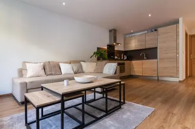 a bedroom with a white bed and a green counter at Chic 1BR ideally located in the city center in Chamonix-Mont-Blanc