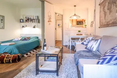 a living room with a couch and a table at Nid douillet a proximite des pistes in Chamonix-Mont-Blanc