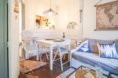 a living room with a couch and a table at Nid douillet a proximite des pistes in Chamonix-Mont-Blanc