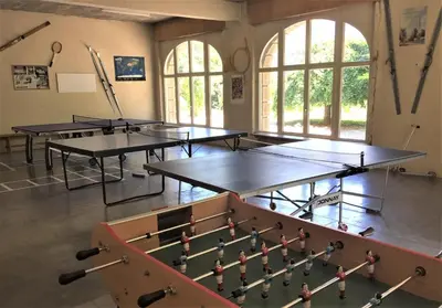 a room with three ping pong tables in it at Résidence du Mont-Blanc n°5Bis in Combloux