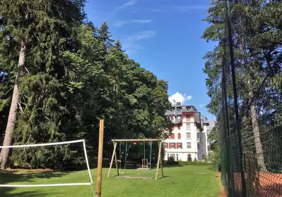 a field with a soccer goal in front of a building at Résidence du Mont-Blanc n°5Bis in Combloux