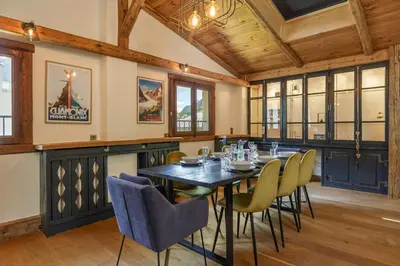 a dining room with a table and chairs at Le Beaulieu - Happy Rentals in Chamonix-Mont-Blanc