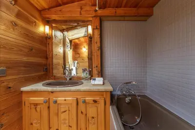 a bathroom with a sink and a bath tub at Le Beaulieu - Happy Rentals in Chamonix-Mont-Blanc