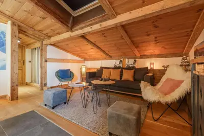 a living room with a couch and chairs at Le Beaulieu - Happy Rentals in Chamonix-Mont-Blanc