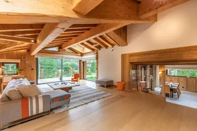 a living room with a couch and a table at DIFY Chalet Contemporain - Les Praz de Chamonix in Chamonix-Mont-Blanc