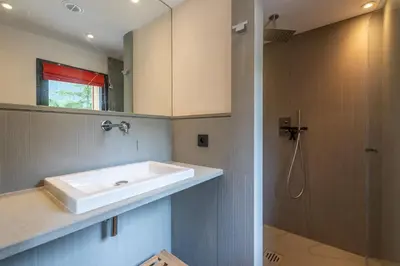 a bathroom with a sink and a shower at DIFY Chalet Contemporain - Les Praz de Chamonix in Chamonix-Mont-Blanc