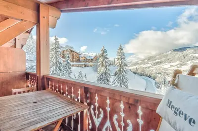 a balcony with a view of a snowy mountain at Appartement Megève - Welkeys in Megève