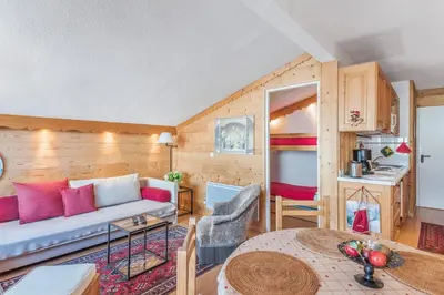 a living room with a couch and a table at Appartement Megève - Welkeys in Megève