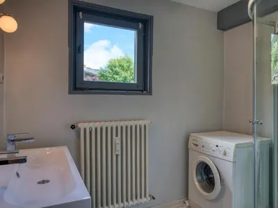 a bathroom with a washing machine and a window at Appart 3 pièces proche télécabine - 5 pers - Wifi - Parking - FR-1-453-229 in Megève