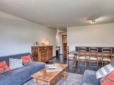 a living room with a couch and a table at Appart 3 pièces proche télécabine - 5 pers - Wifi - Parking - FR-1-453-229 in Megève