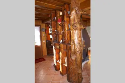 a room with a bunch of logs in a building at Charmant appartement dans chalet in Les Carroz d'Araches