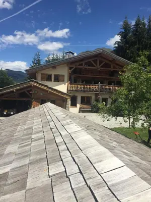 a wooden boardwalk in front of a building at L'Atelier in Les Contamines-Montjoie