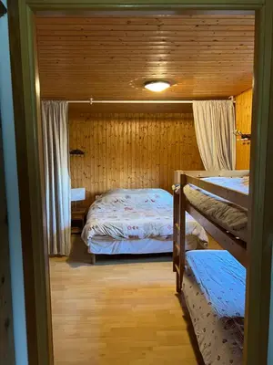 a bedroom with two bunk beds in a room at Appartement Chalet Nerboux in Morillon