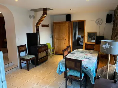 a living room with a table and chairs at Appartement Chalet Nerboux in Morillon