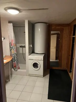 a kitchen with a washing machine and a washer at Appartement Chalet Nerboux in Morillon