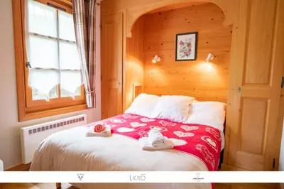 a bedroom with a bed with towels on it at Sur Le Feug Appt 14 in Combloux
