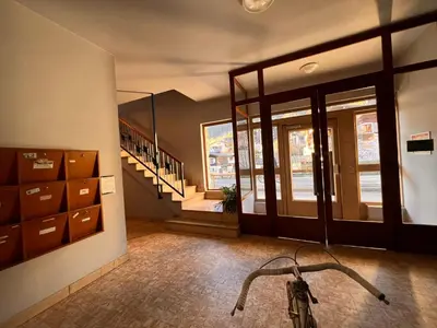 a bike parked in a room with a staircase at Chamonix City Center Luxury Studio Apartment in Chamonix-Mont-Blanc