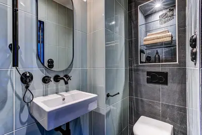 a bathroom with a sink and a toilet at Chamonix City Center Luxury Studio Apartment in Chamonix-Mont-Blanc