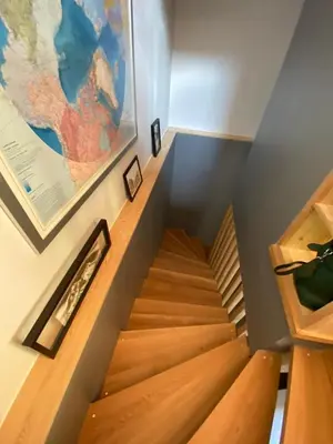 a staircase in a house with wooden floors at Modern Chalet With Garden Chamonix in Chamonix-Mont-Blanc