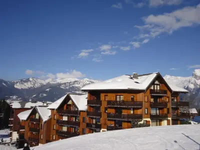 a ski resort in the snow with buildings at Duplex 4 pièces pour 8 personnes au pied des pistes à Morillon - FR-1-815-76 in Morillon