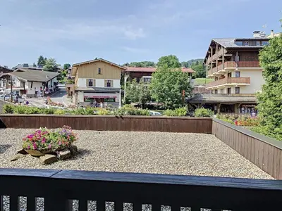 a balcony with a flower pot on top of it at Charmant 2 pièces au centre de Combloux avec balcon - FR-1-560-2 in Combloux