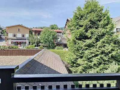 a view from the roof of a house with a tree at Charmant 2 pièces au centre de Combloux avec balcon - FR-1-560-2 in Combloux