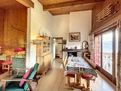 a room with a table and chairs and a window at Appartement cosy à Combloux avec parking et cheminée - FR-1-560-9 in Combloux