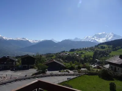 a view of a town with mountains in the background at Appartement cosy à Combloux avec parking et cheminée - FR-1-560-9 in Combloux