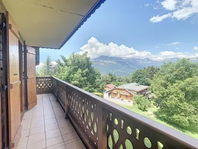 a balcony with a view of a mountain at 3 pièces standing proche centre - Balcon Expo Est - FR-1-560-5 in Combloux
