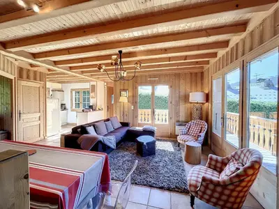 a living room with a couch and chairs at Demi-chalet duplex proche télécabine avec WiFi - FR-1-560-6 in Combloux