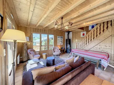 a living room with a couch and a table at Demi-chalet duplex proche télécabine avec WiFi - FR-1-560-6 in Combloux