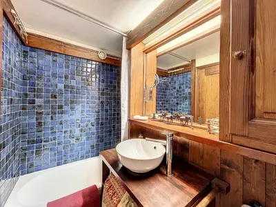 a bathroom with a sink and a tub and a mirror at Charmant duplex près du téléski du Bouchet, idéal pour famille - FR-1-560-11 in Combloux