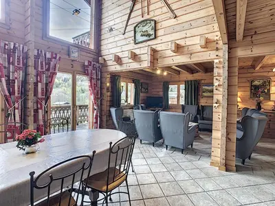 a dining room with a table and chairs at Grand chalet confortable à Demi-Quartier, 13 couchages - FR-1-560-36 in Demi-Quartier