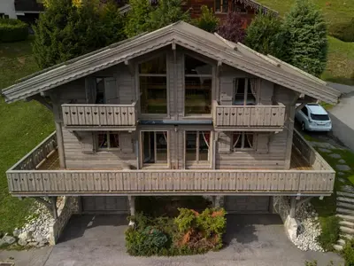 an overhead view of a wooden house with a porch at Grand chalet confortable à Demi-Quartier, 13 couchages - FR-1-560-36 in Demi-Quartier