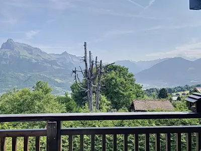 a balcony with a view of a mountain range at Studio agréable au centre de Combloux avec parking - FR-1-560-35 in Combloux