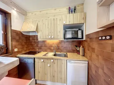 a small kitchen with a sink and a microwave at Appartement 3 pièces de charme aux pieds des pistes à Combloux - FR-1-560-28 in Combloux