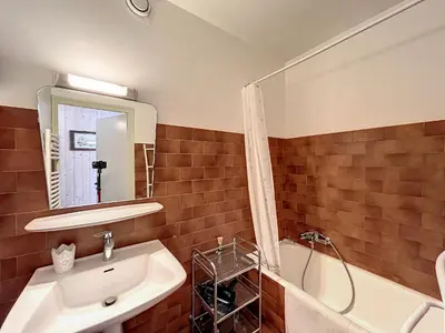 a bathroom with a sink and a shower and a mirror at Appartement 3 pièces de charme aux pieds des pistes à Combloux - FR-1-560-28 in Combloux