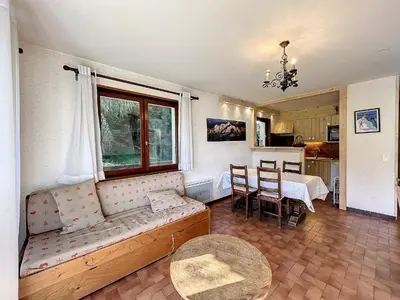 a living room with a couch and a table at Appartement 3 pièces de charme aux pieds des pistes à Combloux - FR-1-560-28 in Combloux