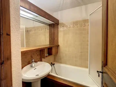a bathroom with a sink and a bath tub at Studio cabine cosy proche du téléski - FR-1-560-40 in Combloux