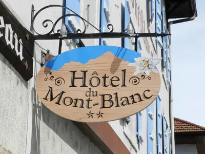 a sign for a hotel on a mont blanc building at Hotel du Mont Blanc in Sallanches