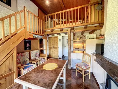 a dining room with a table in a cabin at Duplex cosy au pied des pistes de Combloux - FR-1-560-47 in Combloux