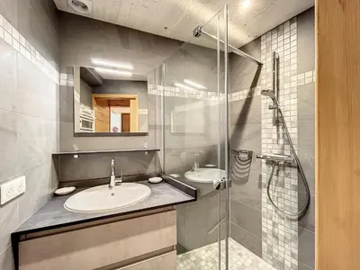 a bathroom with two sinks and a glass shower at Appartement cosy au pied des pistes à Combloux avec balcon et casier à skis - FR-1-560-61 in Combloux