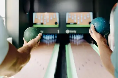 a man playing a game of bowling at PlanB - Living Saint-Gervais - 250m des Remontées Mécaniques in Saint-Gervais-les-Bains