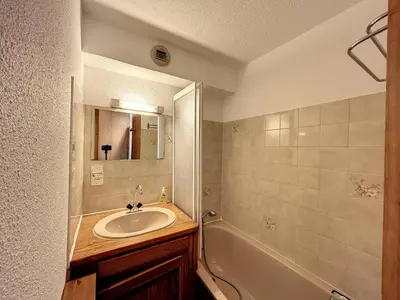 a bathroom with a sink and a mirror and a tub at Studio cabine proche centre Combloux, 4 pers, balcon, parking - FR-1-560-53 in Combloux